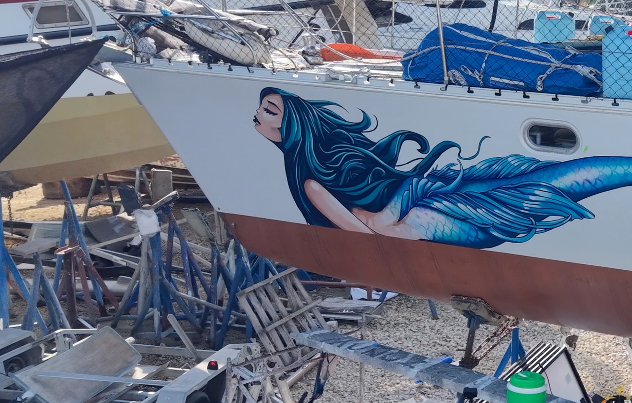 Drydock close-up of mermaid hull graphic