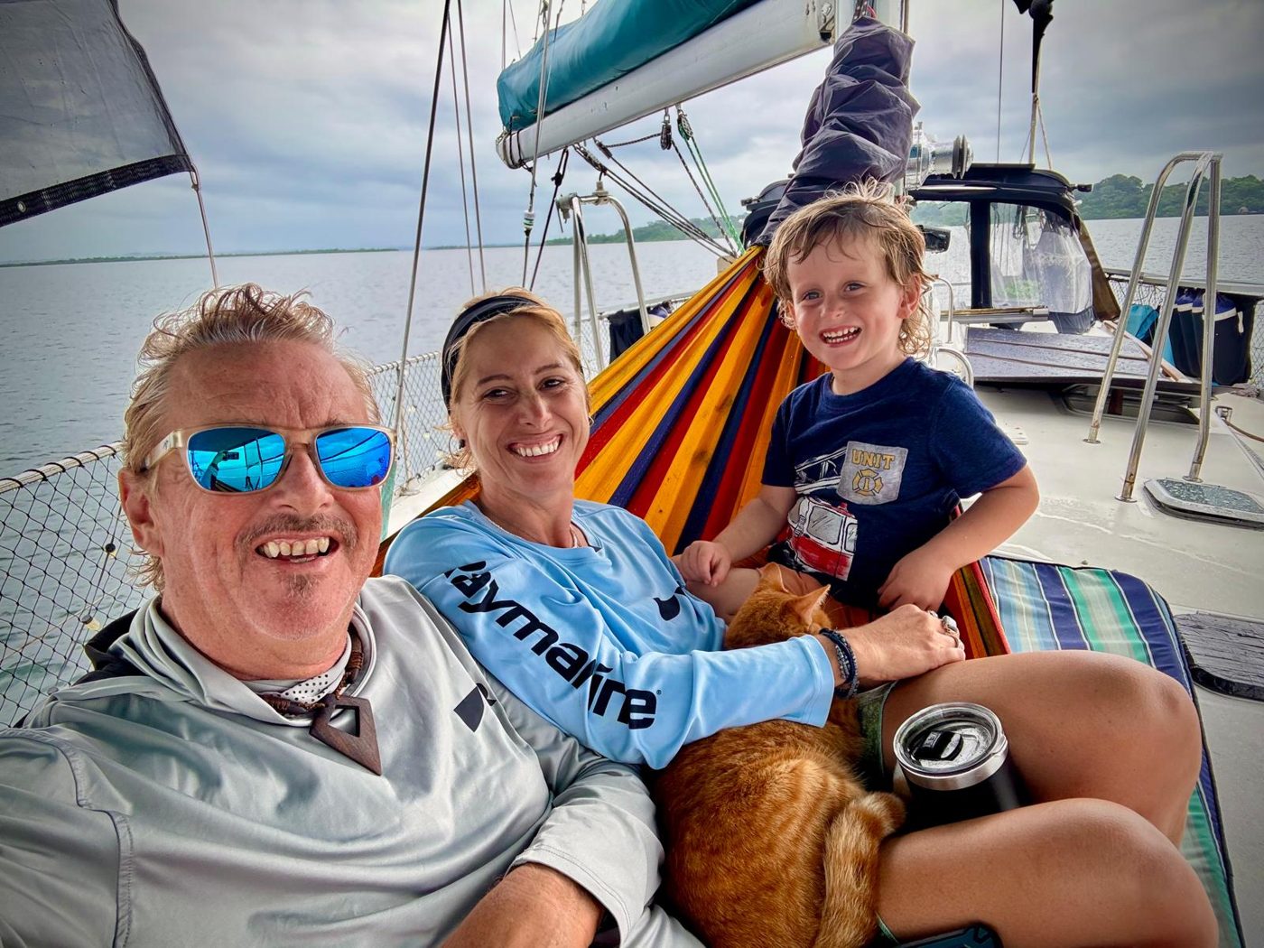 The family relaxing in the hammock aboard