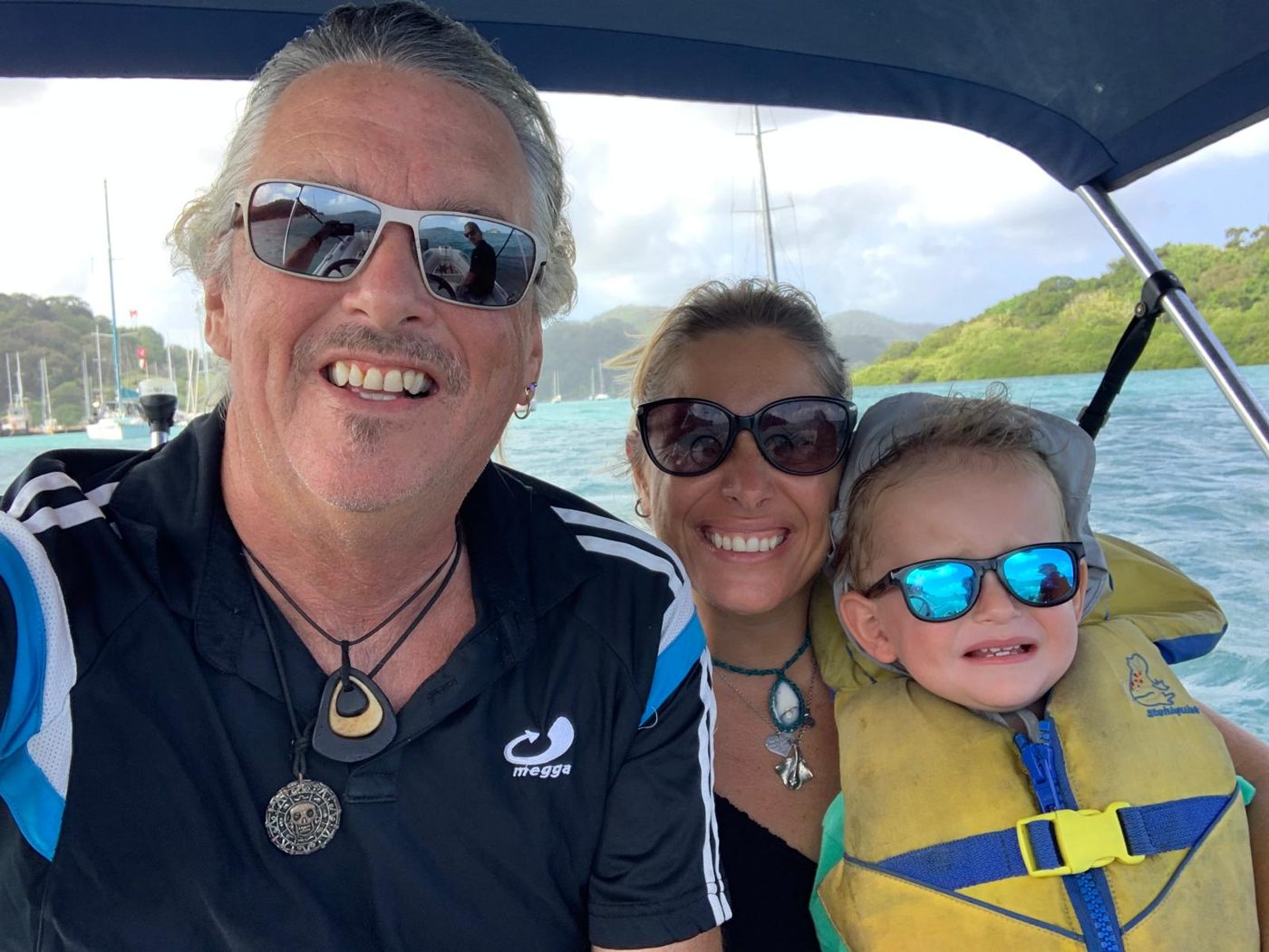 The family in the tender, Ricci in his life jacket