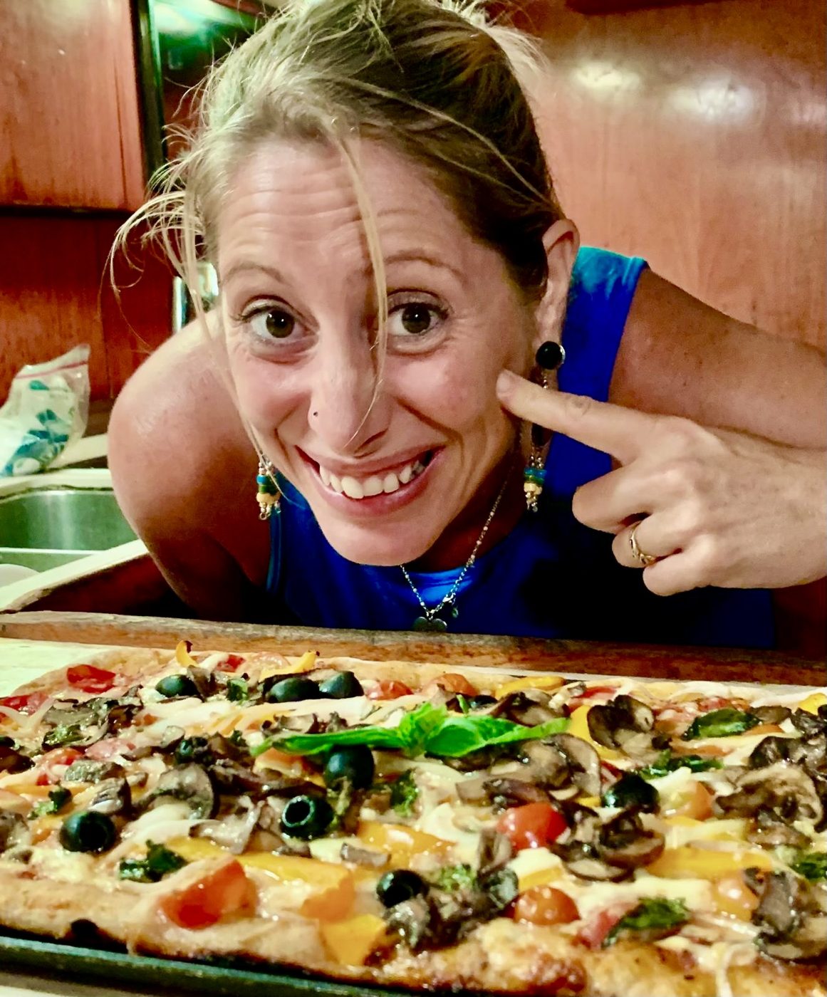 Maddy with a homemade veggie pizza