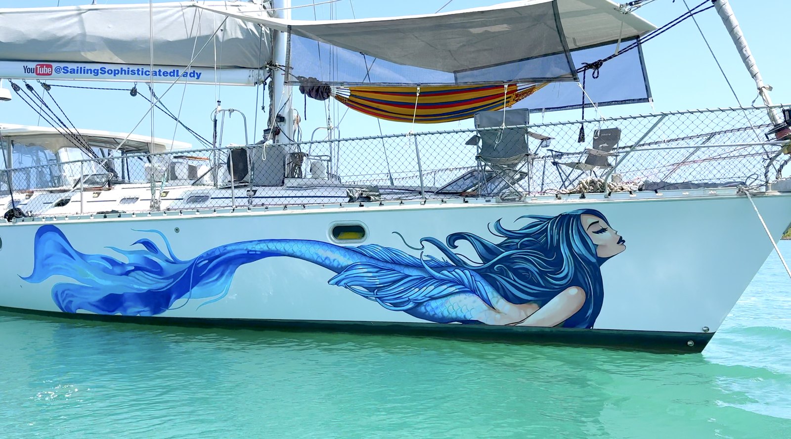 Mermaid hull graphic on Sophisticated Lady — homepage hero still