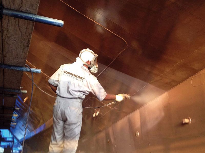 CopperCoat being sprayed onto a large ship hull
